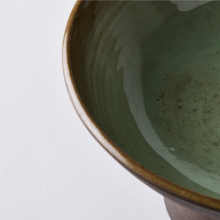 Pistachio green ceramic bowl on stand