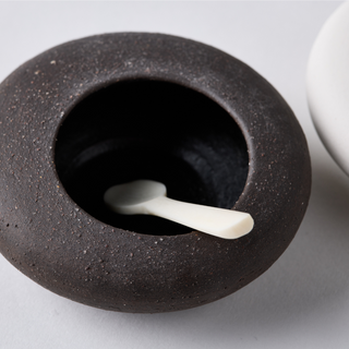 Pebble shaped salt and pepper pots with spoon - warm white & charcoal