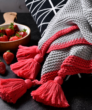 Au Contraire Throw in Light Grey with Raspberry